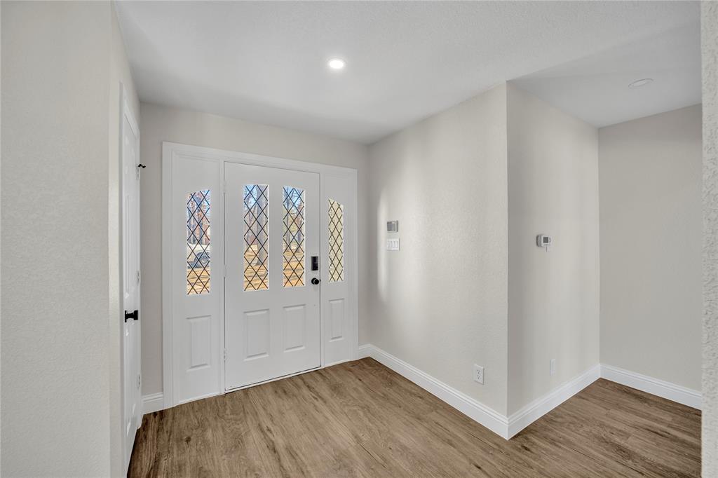 7004 Ledbetter Road Arlington, TX 76001 - Photo 13 of 39 an empty room with wooden floor and closet
