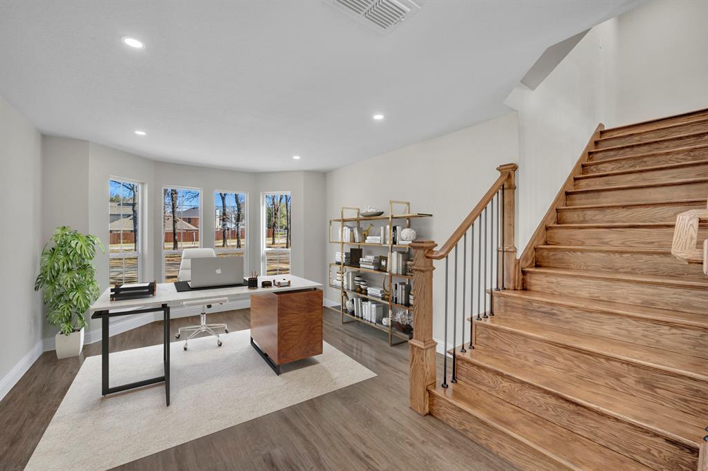 7004 Ledbetter Road Arlington, TX 76001 - Photo 15 of 39 a livingroom with furniture wooden floor and windows