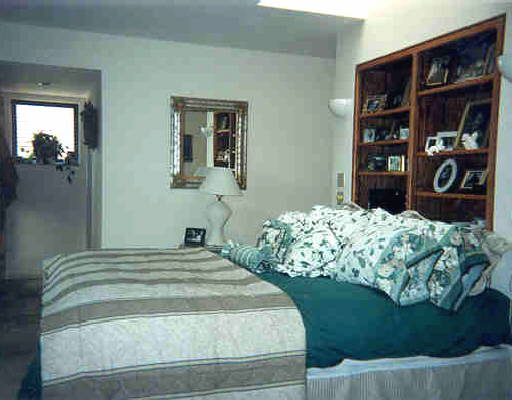 4210 Christy Way Reno, NV 89519 - Photo 3 of 3 a bedroom with a bed and painting on the wall