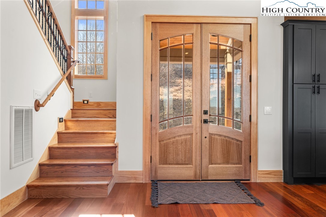 171 Pleasant View Vilas, NC 28692 - Photo 13 of 49 a view of entryway with wooden floor and stairs