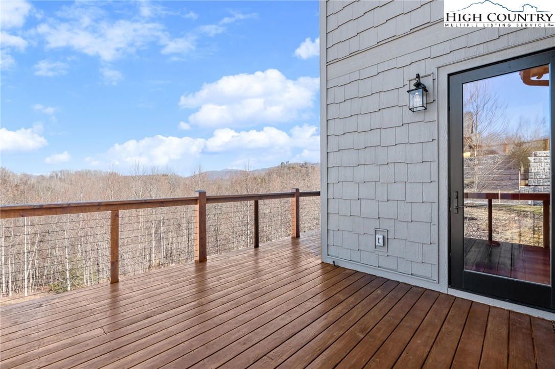 171 Pleasant View Vilas, NC 28692 - Photo 16 of 49 a view of a balcony with wooden floor