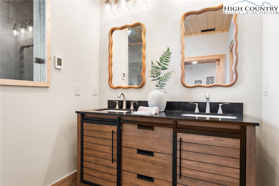 171 Pleasant View Vilas, NC 28692 - Photo 21 of 49 a bathroom with a sink and a mirror