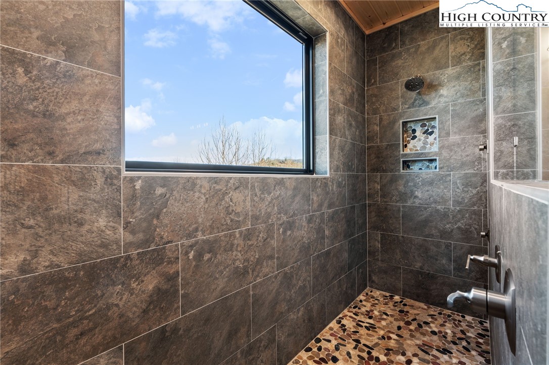171 Pleasant View Vilas, NC 28692 - Photo 23 of 49 a bathroom with a shower