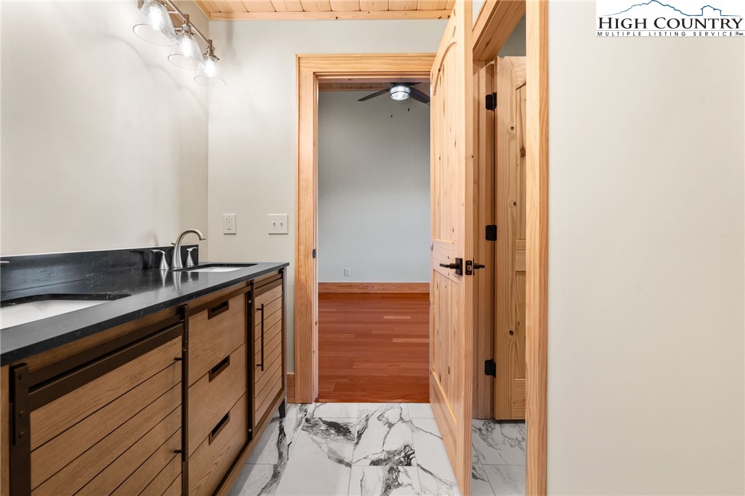 171 Pleasant View Vilas, NC 28692 - Photo 30 of 49 a bathroom with a sink and a mirror