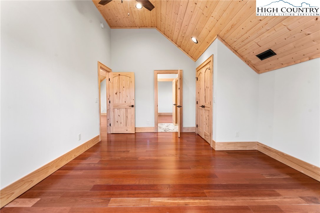 171 Pleasant View Vilas, NC 28692 - Photo 34 of 49 a view of an empty room with wooden floor and a window