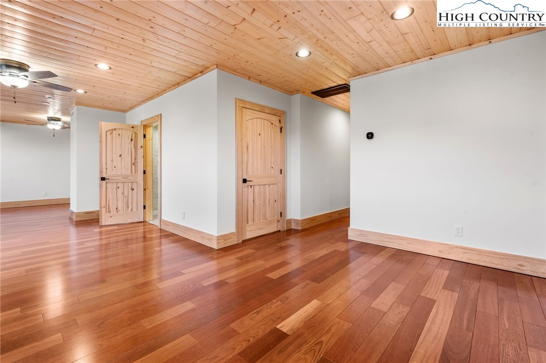 171 Pleasant View Vilas, NC 28692 - Photo 38 of 49 a view of an empty room with wooden floor