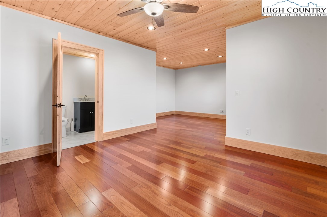 171 Pleasant View Vilas, NC 28692 - Photo 39 of 49 a view of an empty room with wooden floor