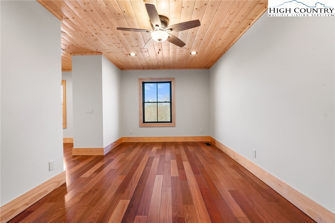 171 Pleasant View Vilas, NC 28692 - Photo 41 of 49 a view of empty room with wooden floor
