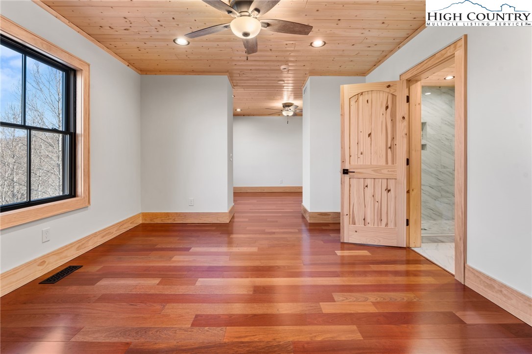 171 Pleasant View Vilas, NC 28692 - Photo 43 of 49 a view of empty room with wooden floor and fan