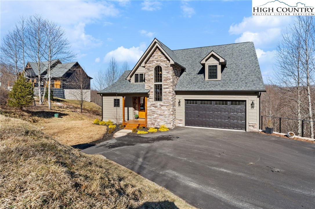 171 Pleasant View Vilas, NC 28692 - Photo 49 of 49 a view of a house with a yard and large tree