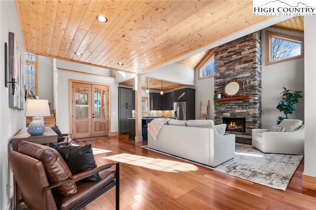 171 Pleasant View Vilas, NC 28692 - Photo 5 of 49 a living room with furniture a fireplace and a table