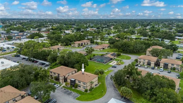 an aerial view of a house with a garden