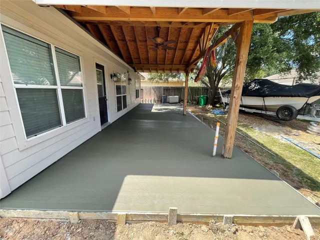 a view of a car park in front of a house