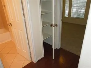 a view of a bathroom with a wooden floor
