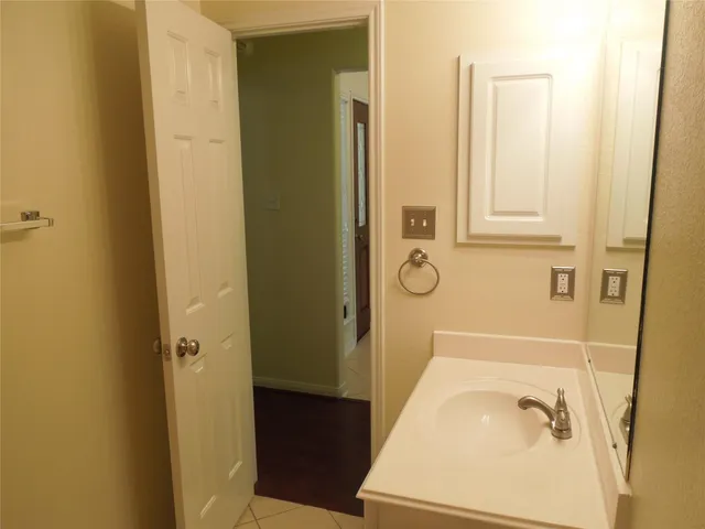 a bathroom with a tub and sink