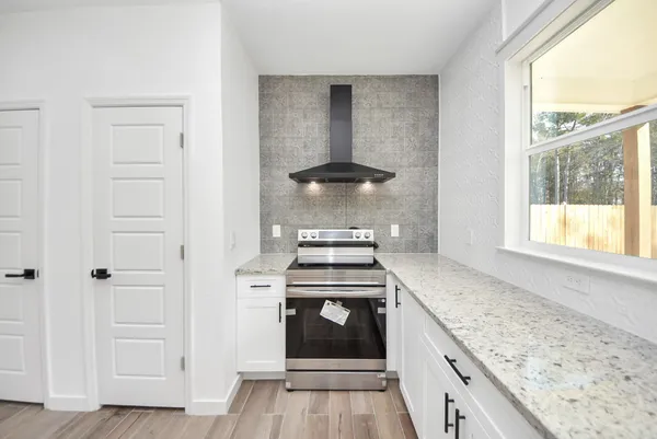 a view of yard with trees in the background