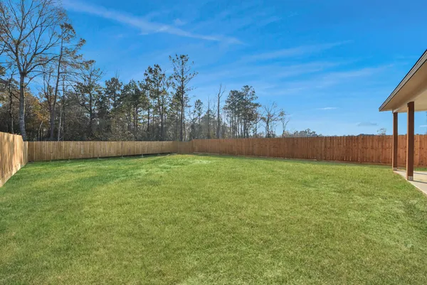 a backyard of a house with lots of green space