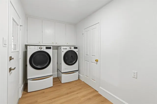 a view of a kitchen with washer and dryer