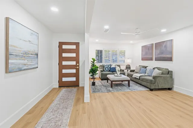 a living room with furniture and a rug