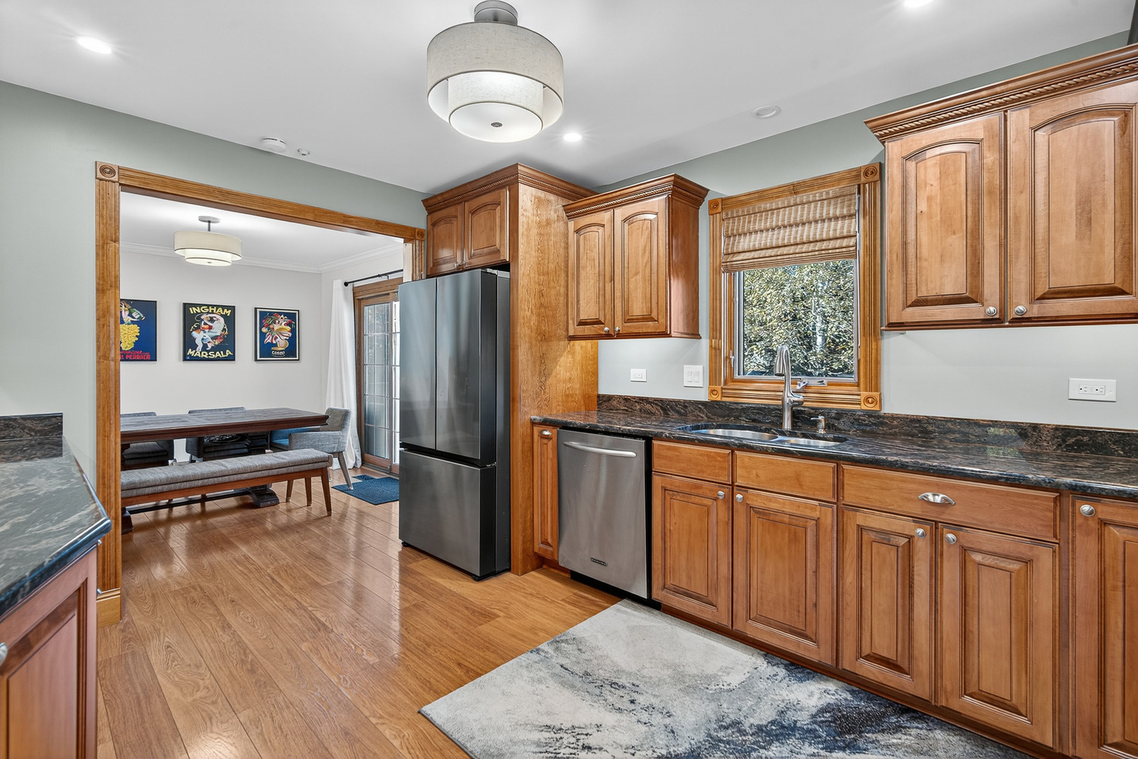 7800 Brunswick Road Darien, IL 60561 - Photo 8 of 33 a kitchen with stainless steel appliances granite countertop a refrigerator a sink dishwasher a stove and white countertops with wooden floor