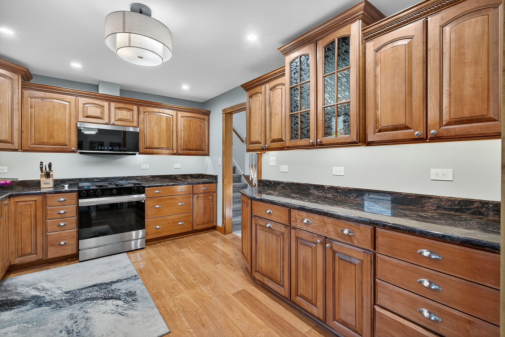 7800 Brunswick Road Darien, IL 60561 - Photo 9 of 33 a kitchen with stainless steel appliances granite countertop a stove and cabinets