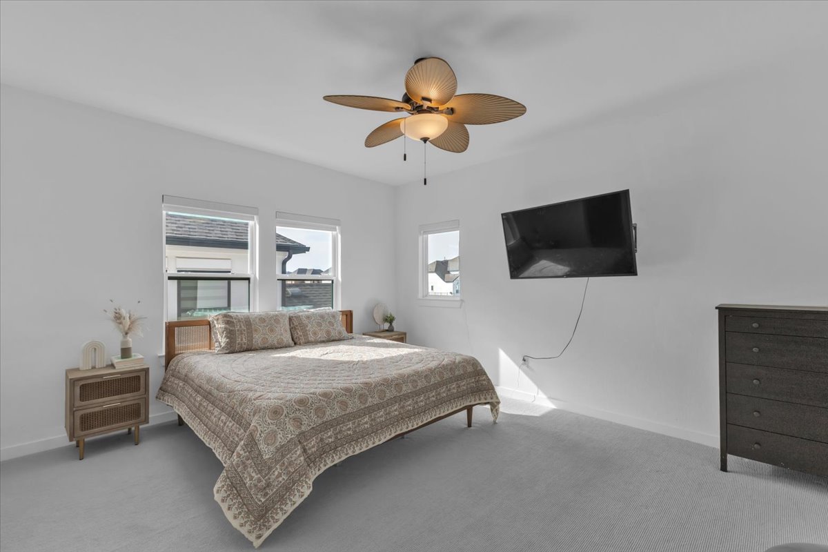 2312 Mondello Path Leander, TX 78641 - Photo 31 of 40 a bedroom with a bed and a flat screen tv