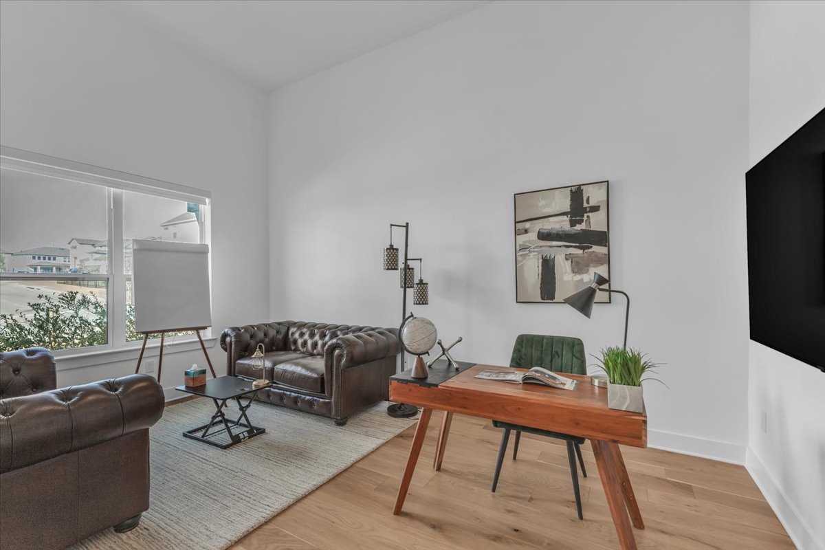 2312 Mondello Path Leander, TX 78641 - Photo 8 of 40 a living room with furniture and a flat screen tv