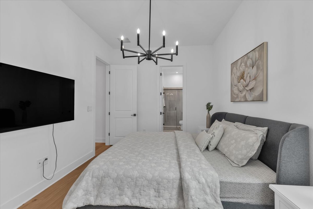 2312 Mondello Path Leander, TX 78641 - Photo 10 of 40 a bedroom with a bed and a flat screen tv