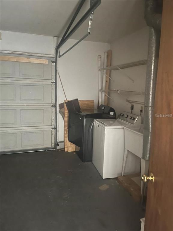 2024 Southwest 73rd Terrace Gainesville, FL 32607 - Photo 8 of 9 a utility room with dryer and washer