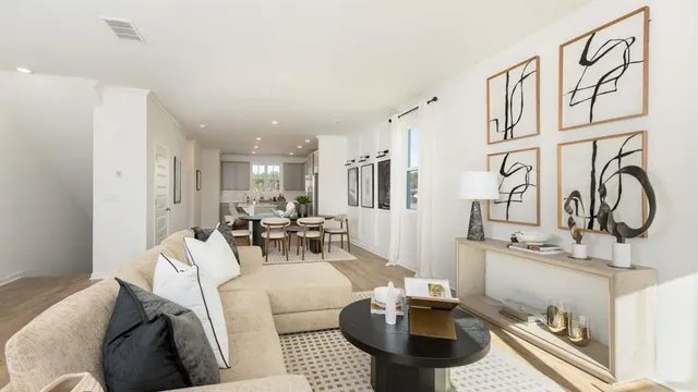 a living room with furniture and a table