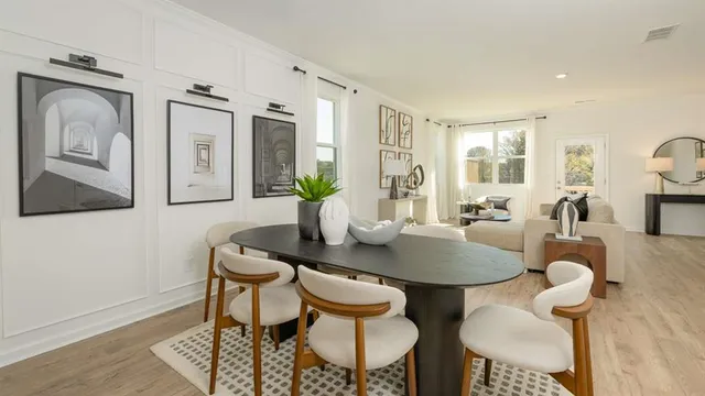 a kitchen that has a refrigerator a sink and cabinets