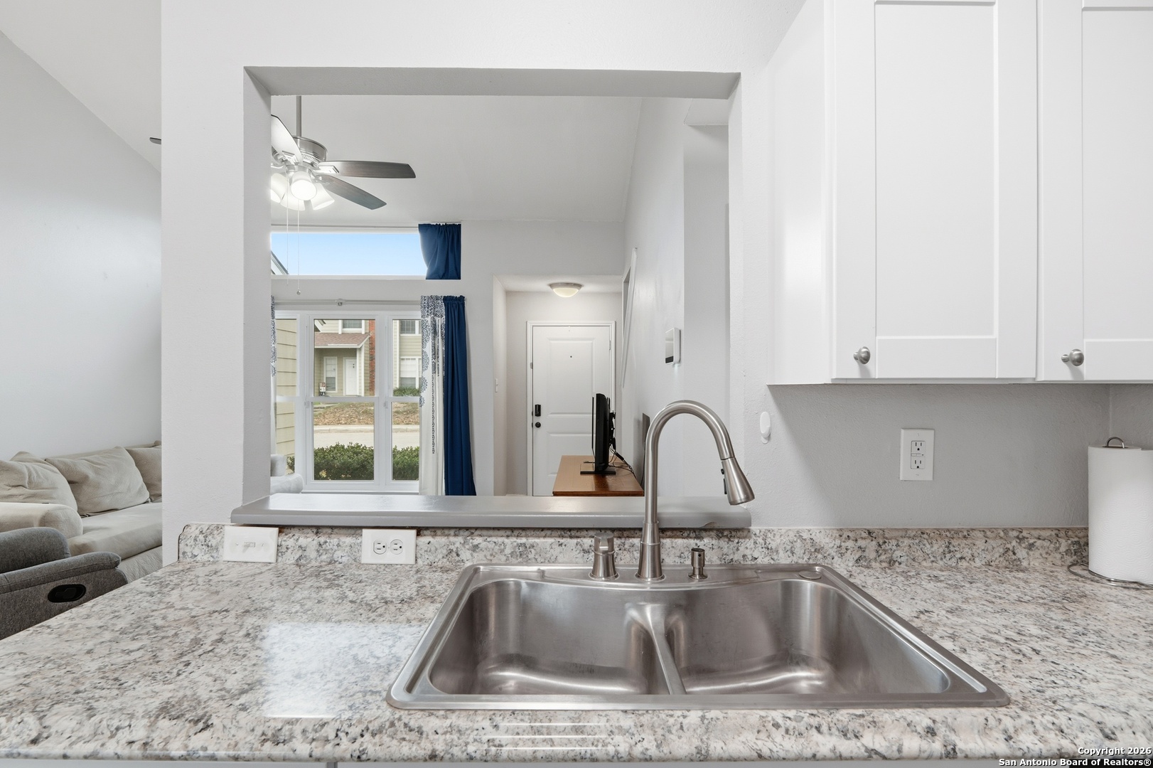 9140 Timber Path, Unit 3003 San Antonio, TX 78250 - Photo 17 of 38 a kitchen with a sink cabinets and window