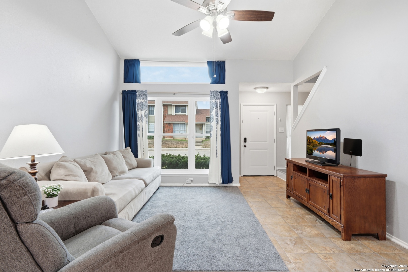 9140 Timber Path, Unit 3003 San Antonio, TX 78250 - Photo 2 of 38 a living room with furniture and a flat screen tv