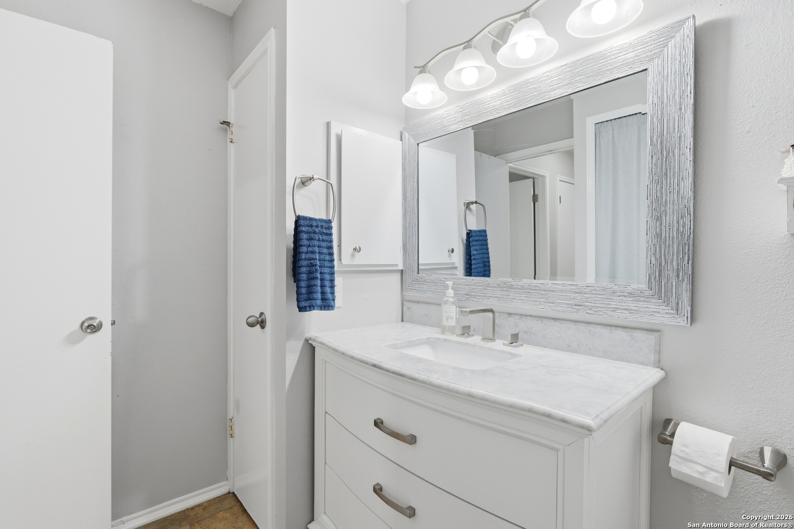 9140 Timber Path, Unit 3003 San Antonio, TX 78250 - Photo 21 of 38 a bathroom with a sink vanity and a mirror