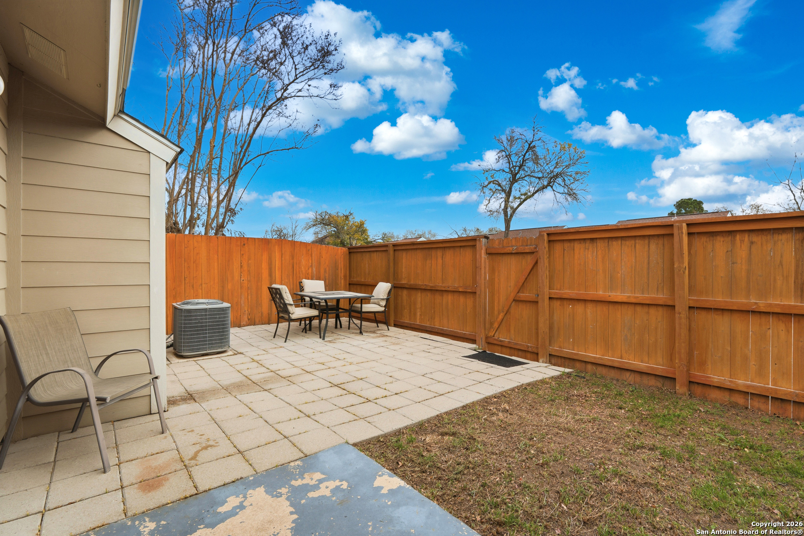 9140 Timber Path, Unit 3003 San Antonio, TX 78250 - Photo 6 of 38 a view of a chairs and table in backyard