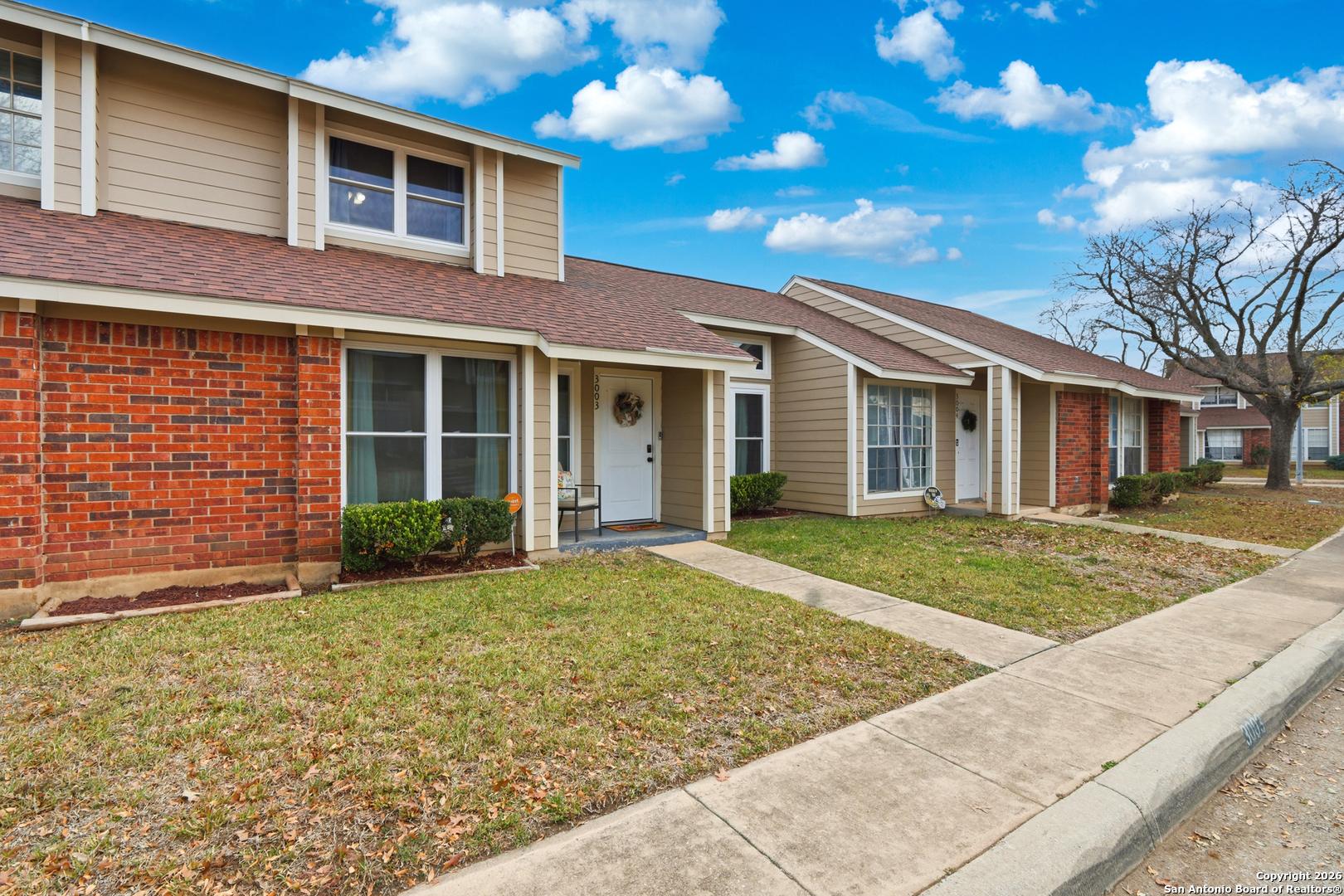 9140 Timber Path, Unit 3003 San Antonio, TX 78250 - Photo 9 of 38 a view of a yard in front of a house