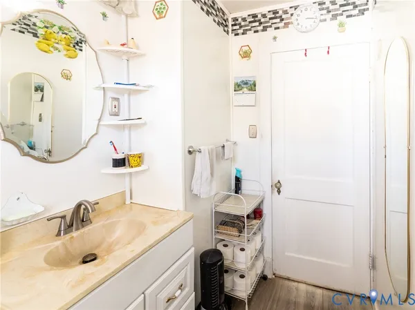 a bathroom with a sink and a mirror