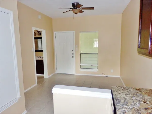 a living room with a couch and a rug