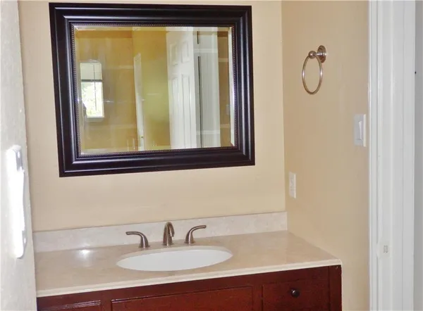 a bathroom with a sink and a mirror