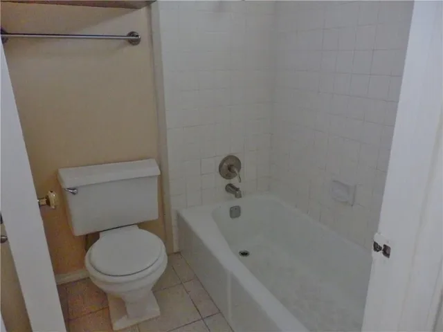 a view of a room with a flat screen tv