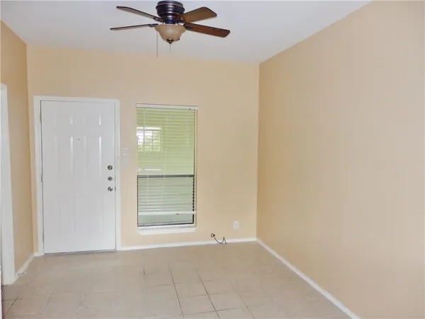 a view of an empty room and window