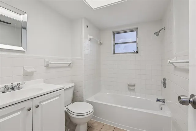 a bathroom with a sink toilet and bathtub