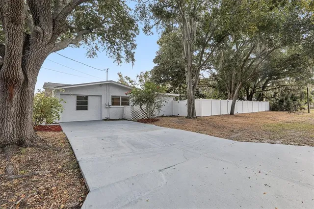 a view of a house with a yard and garage