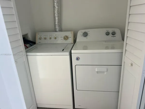 a utility room with dryer and washer