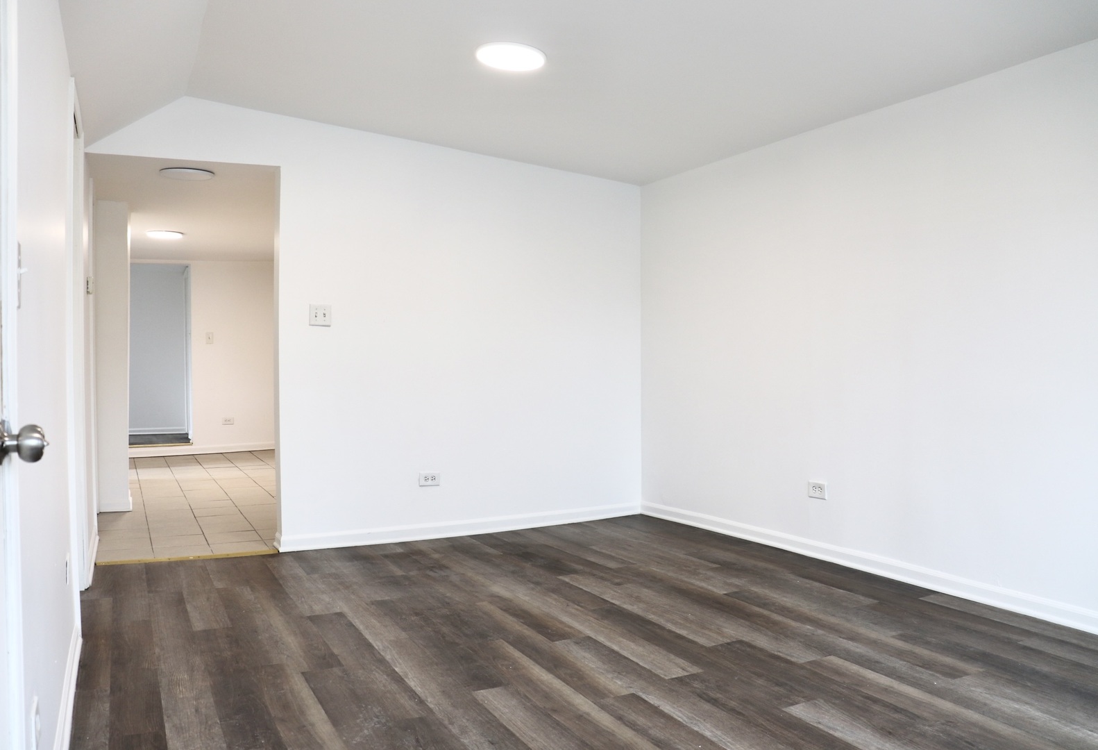 2502 West 46th Street, Unit 2 Chicago, IL 60632 - Photo 2 of 11 an empty room with wooden floor and windows