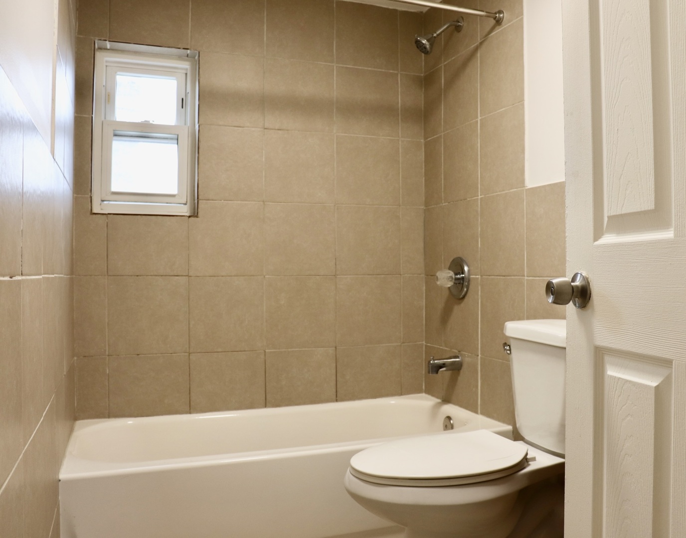 2502 West 46th Street, Unit 2 Chicago, IL 60632 - Photo 7 of 11 a bathroom with a toilet and a bathtub