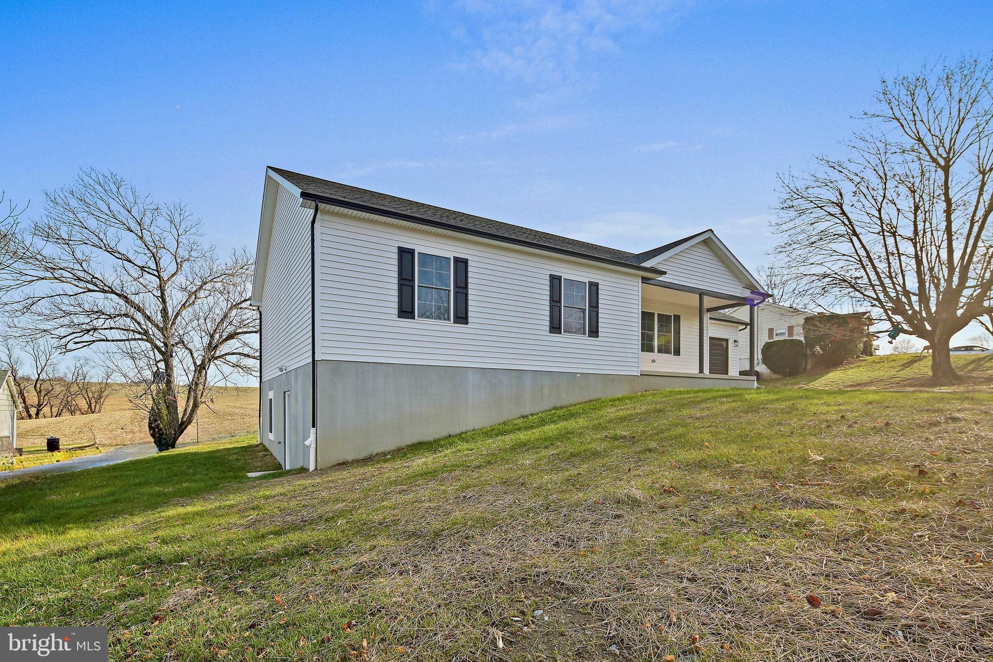 335 East Snyder Corner Road Red Lion, PA 17356 - Photo 3 of 34 a house view with a garden space