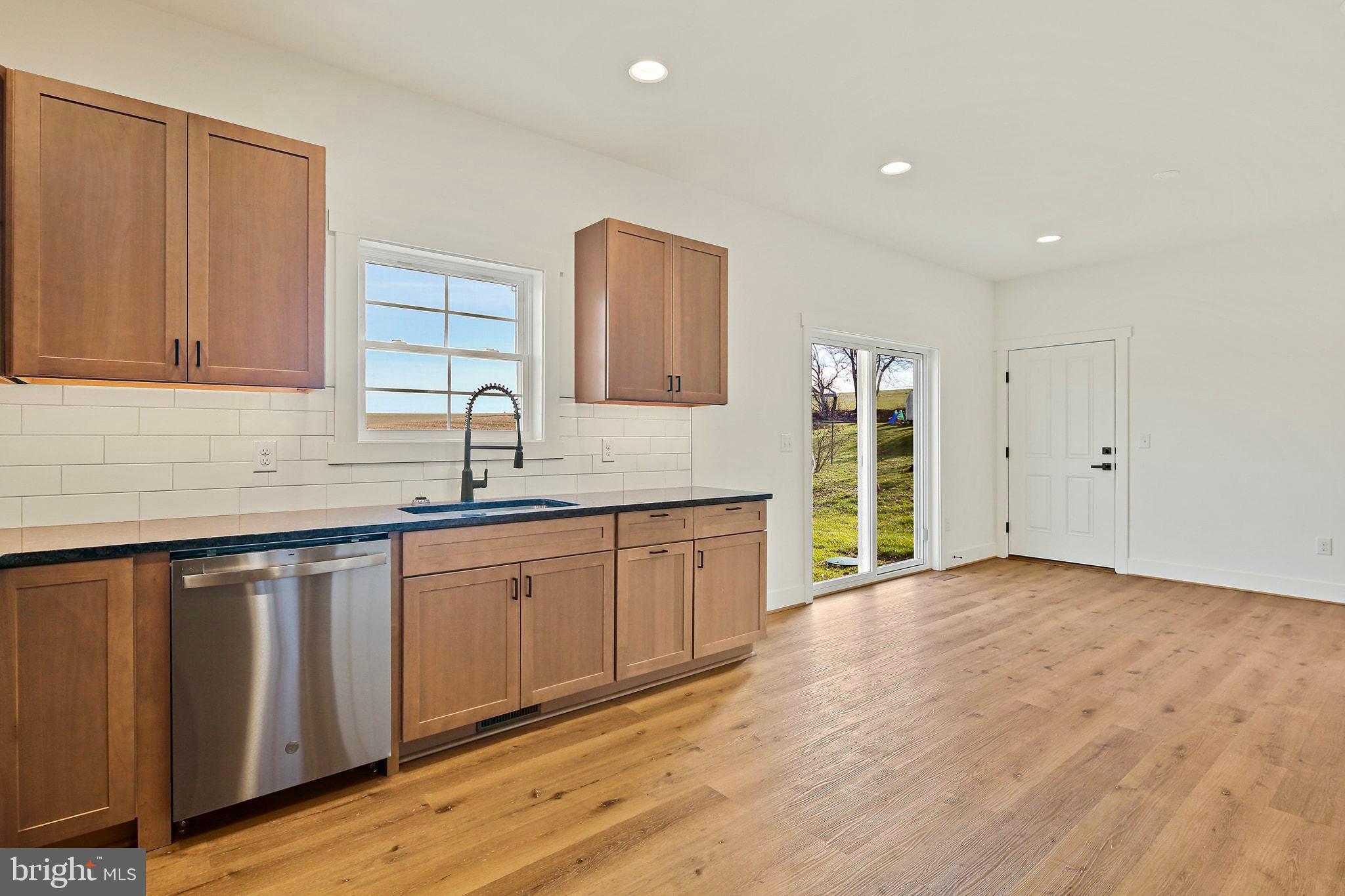 335 East Snyder Corner Road Red Lion, PA 17356 - Photo 5 of 34 a kitchen with granite countertop a sink stainless steel appliances and cabinets