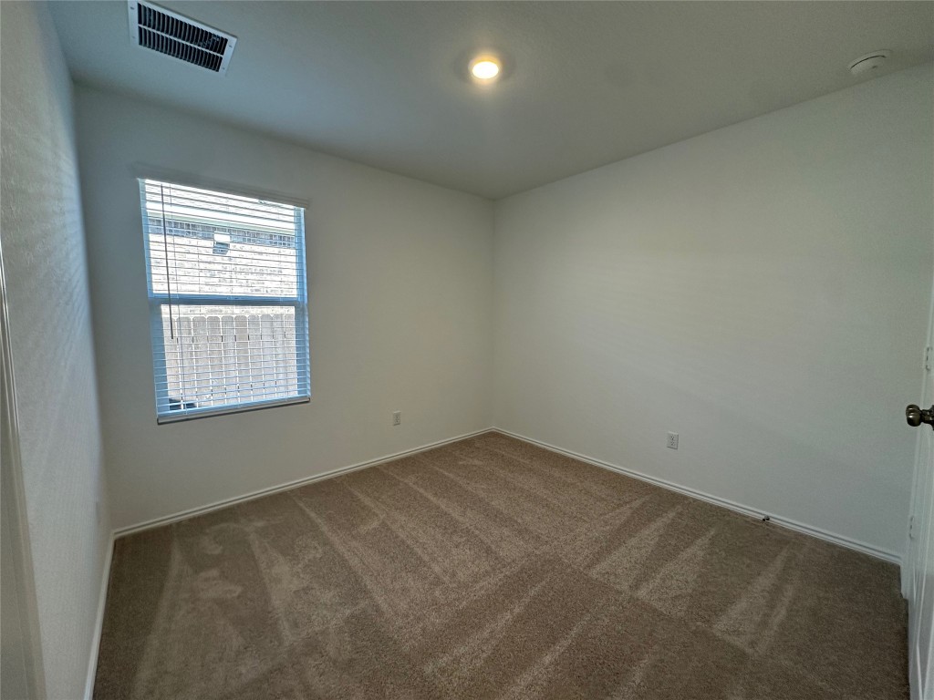 2513 Four Waters Loop Georgetown, TX 78628 - Photo 21 of 37 Carpeted spare room with baseboards