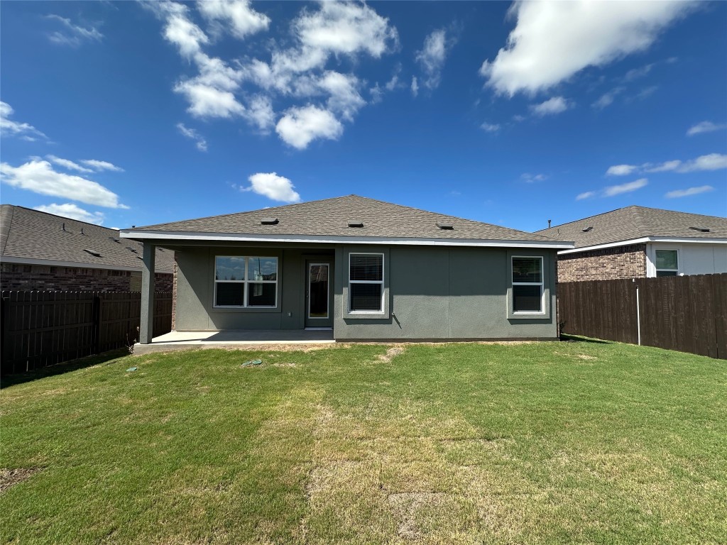 2513 Four Waters Loop Georgetown, TX 78628 - Photo 31 of 37 Back of house featuring a patio, stucco siding, a fenced backyard, and a shingled roof